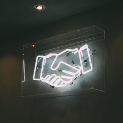 Glowing Handshaking as a symbol for custom communication