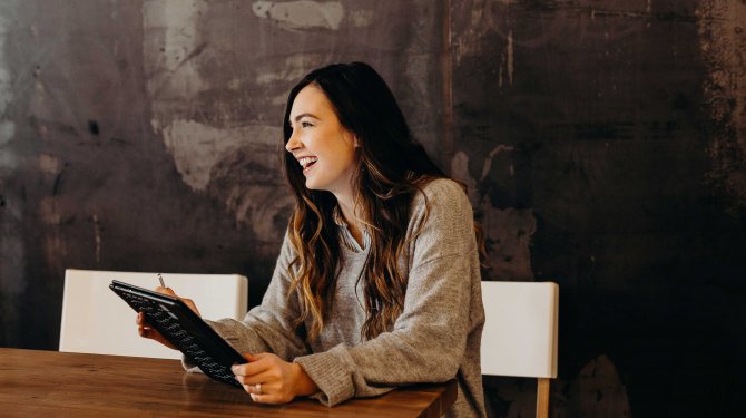 Happy woman with a tablet 